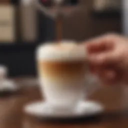 Close-up view of a mini electric frother in action, creating froth in a cup of coffee.