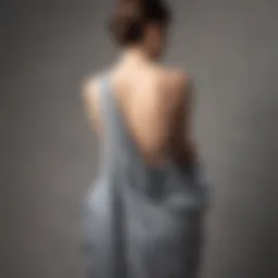 Elegant backless drape dress showcased on a mannequin